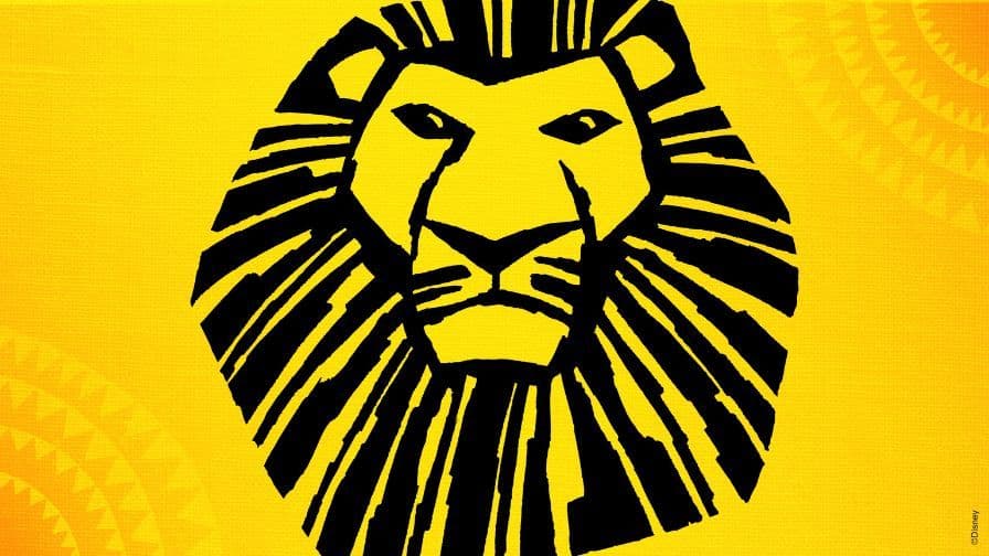 The iconic black lion head logo from The Lion King musical against a yellow background.