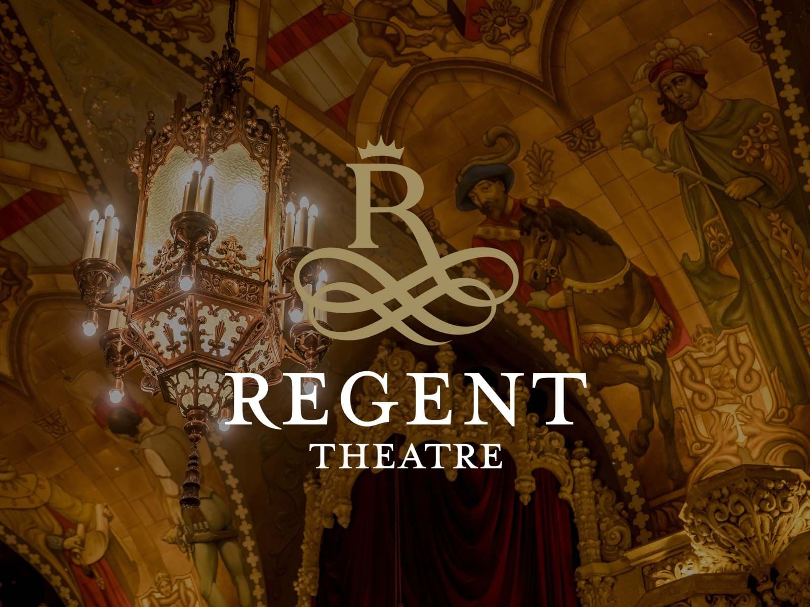 Regent Theatre logo overlays a luxurious, ornate theater interior with a grand chandelier.